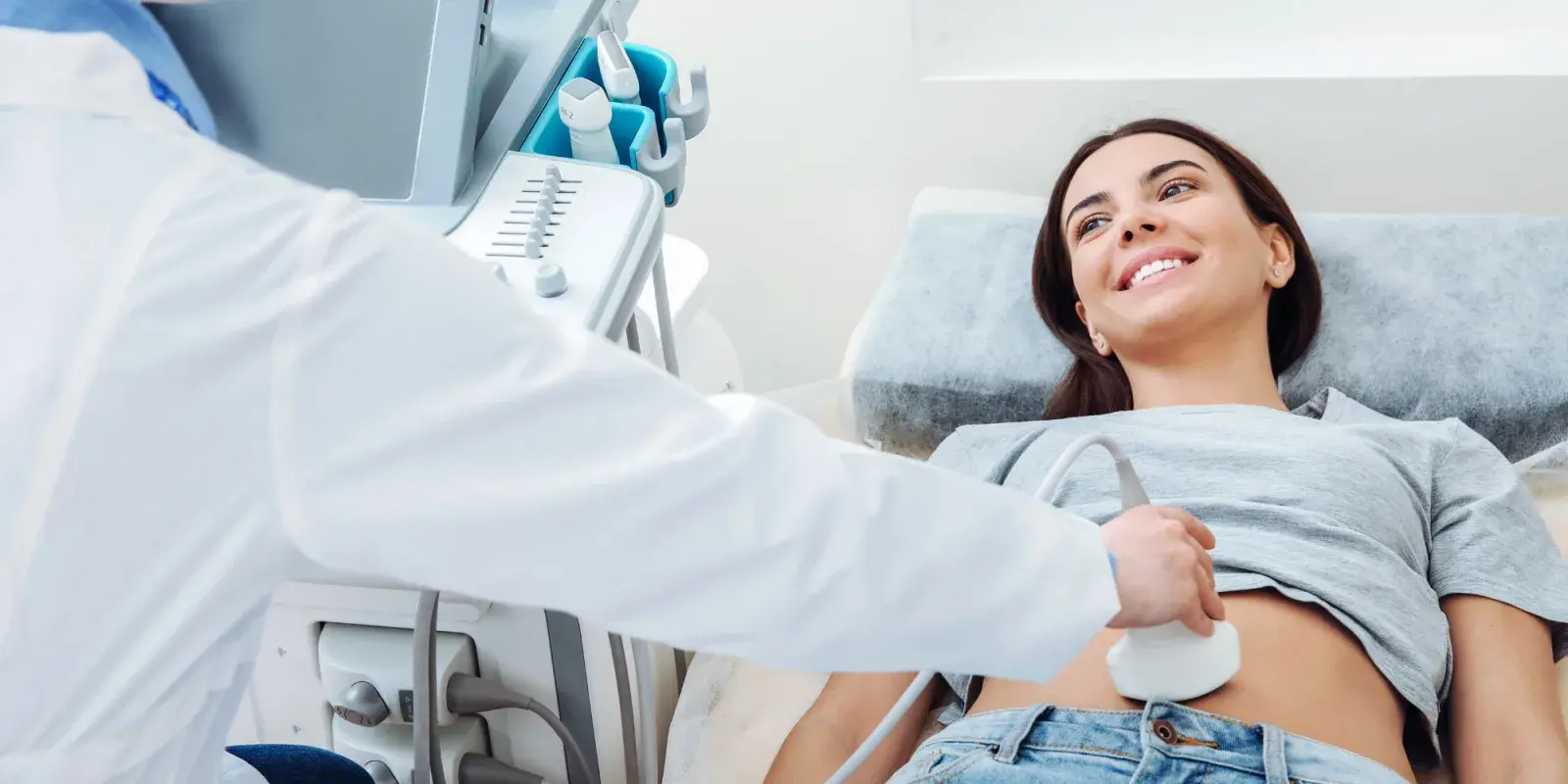 A clinician performing an ultrasound for a patient