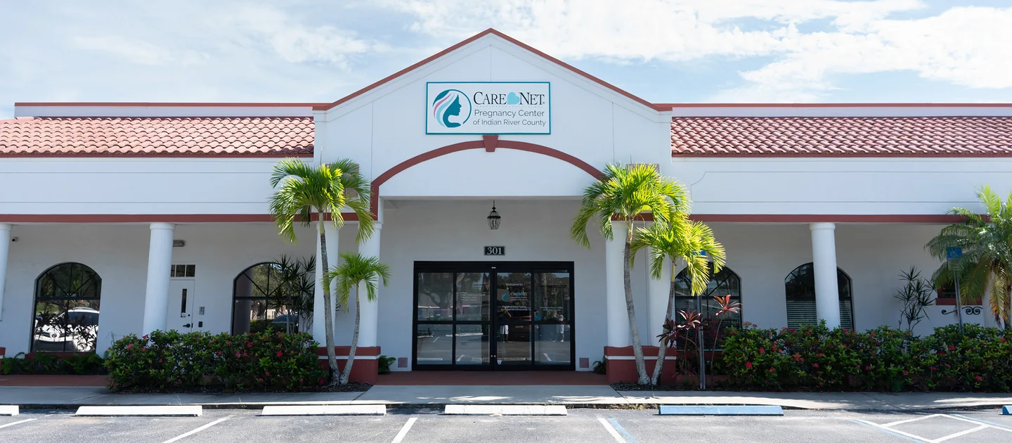 Care Net’s entrance at Suite 301, with its sign above the glass doors